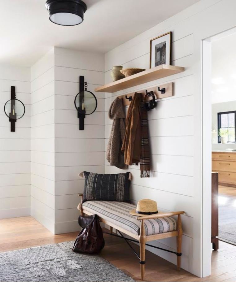 Floating shelves for storage in a small entrance lobby