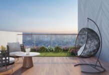 Compact Balcony Garden Styling Ideas for High-Rise City Apartments Modern high-rise apartment balcony garden with potted plants hanging chair and sweeping city skyline view