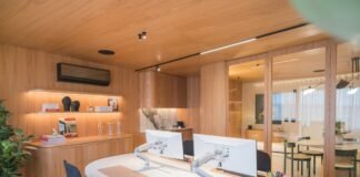 Ergonomic Home Office Layout Ideas for Productivity and Posture Wellness Modern ergonomic home office workstation with dual monitor setup wooden accents and task lighting