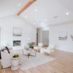 Bright contemporary living room featuring open concept natural wood plank flooring with modern furniture