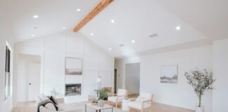 Engineered Hardwood vs Luxury Vinyl Plank Durability and Cost Comparison for Homes Bright contemporary living room featuring open concept natural wood plank flooring with modern furniture
