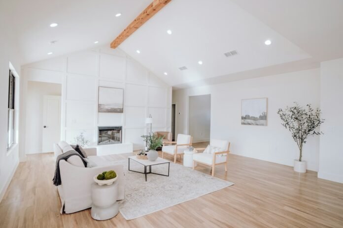 Bright contemporary living room featuring open concept natural wood plank flooring with modern furniture
