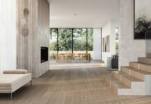 Large Format Porcelain Floor Tiles for High-Traffic Open-Concept Residences Modern luxury open concept living room featuring expansive large format polished porcelain floor tiles
