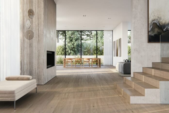 Modern luxury open concept living room featuring expansive large format polished porcelain floor tiles