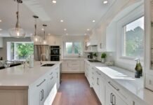 Load-Bearing Wall Removal and Open-Concept Kitchen Structural Remodeling Guidelines Renovated modern open concept kitchen with spacious island where a load bearing wall was removed