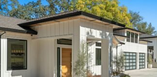 Contemporary Modern Farmhouse Exterior Siding and Black Window Frame Combinations Contemporary modern farmhouse exterior featuring crisp white vertical board and batten siding high contrast black window frames and warm natural wood accents