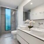 Modern small bathroom remodeling ideas with space-saving floating vanity and walk-in shower