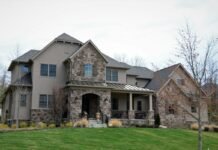 Natural Stone Veneer Facade Designs for Stunning Front Porch Curb Appeal Stunning luxury home exterior entrance with natural stone veneer facade pedestals and manicured front lawn curb appeal