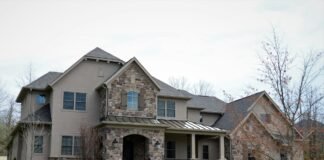 Natural Stone Veneer Facade Designs for Stunning Front Porch Curb Appeal Stunning luxury home exterior entrance with natural stone veneer facade pedestals and manicured front lawn curb appeal