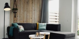 Handwoven Wool Area Rug Placement Rules for Anchoring Living Room Seating Handwoven wool area rug anchoring a modern living room seating arrangement with sectional sofa coffee table and warm hardwood flooring