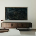 Mid-century modern teak wooden credenza and media console with clean Scandinavian lines and curated living room accessories