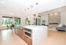 Quartz vs Granite Kitchen Island Countertops Heat Resistance and Stain Defense Luxury kitchen island featuring durable engineered quartz and natural granite countertop with modern cabinetry
