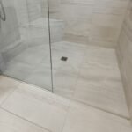 Contemporary master bathroom walk-in shower tile layout with large format porcelain and recessed niche