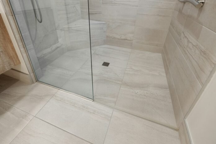 Walk-In Shower Tile Layout Inspirations for Contemporary Master Bathrooms Contemporary master bathroom walk-in shower tile layout with large format porcelain and recessed niche