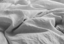 Organic Linen Bedding Styling Essentials for Breathable Year-Round Sleeping Organic linen bedding styling essentials layered in a serene modern master bedroom