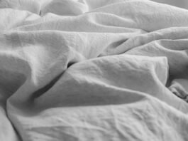 Organic Linen Bedding Styling Essentials for Breathable Year-Round Sleeping Organic linen bedding styling essentials layered in a serene modern master bedroom