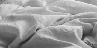 Organic Linen Bedding Styling Essentials for Breathable Year-Round Sleeping Organic linen bedding styling essentials layered in a serene modern master bedroom