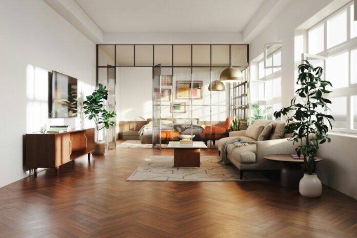 Modern studio apartment room divider and sliding glass partition system separating living and bedroom areas